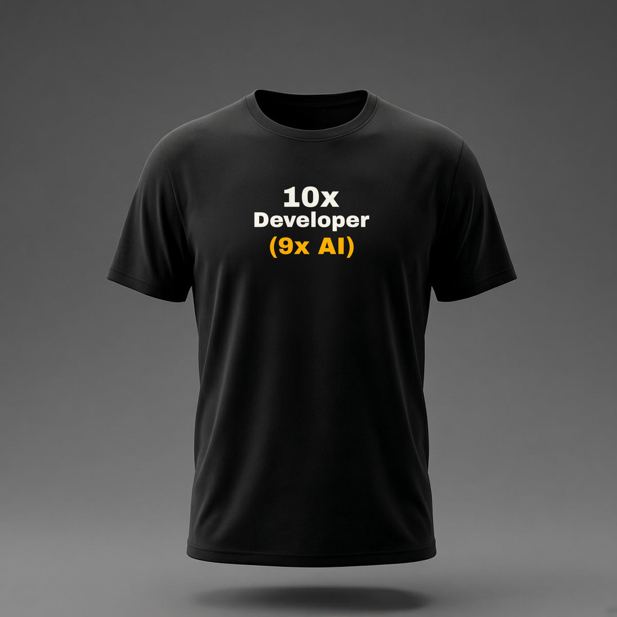 Front view: Black t-shirt floating on a grey background with '10x Developer (9x AI)' with the footnote in amber printed across the chest in off-white and amber.