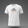 Front view: White t-shirt floating on a grey background with '10x Developer (9x AI)' with the footnote in amber printed across the chest in black and dark amber.