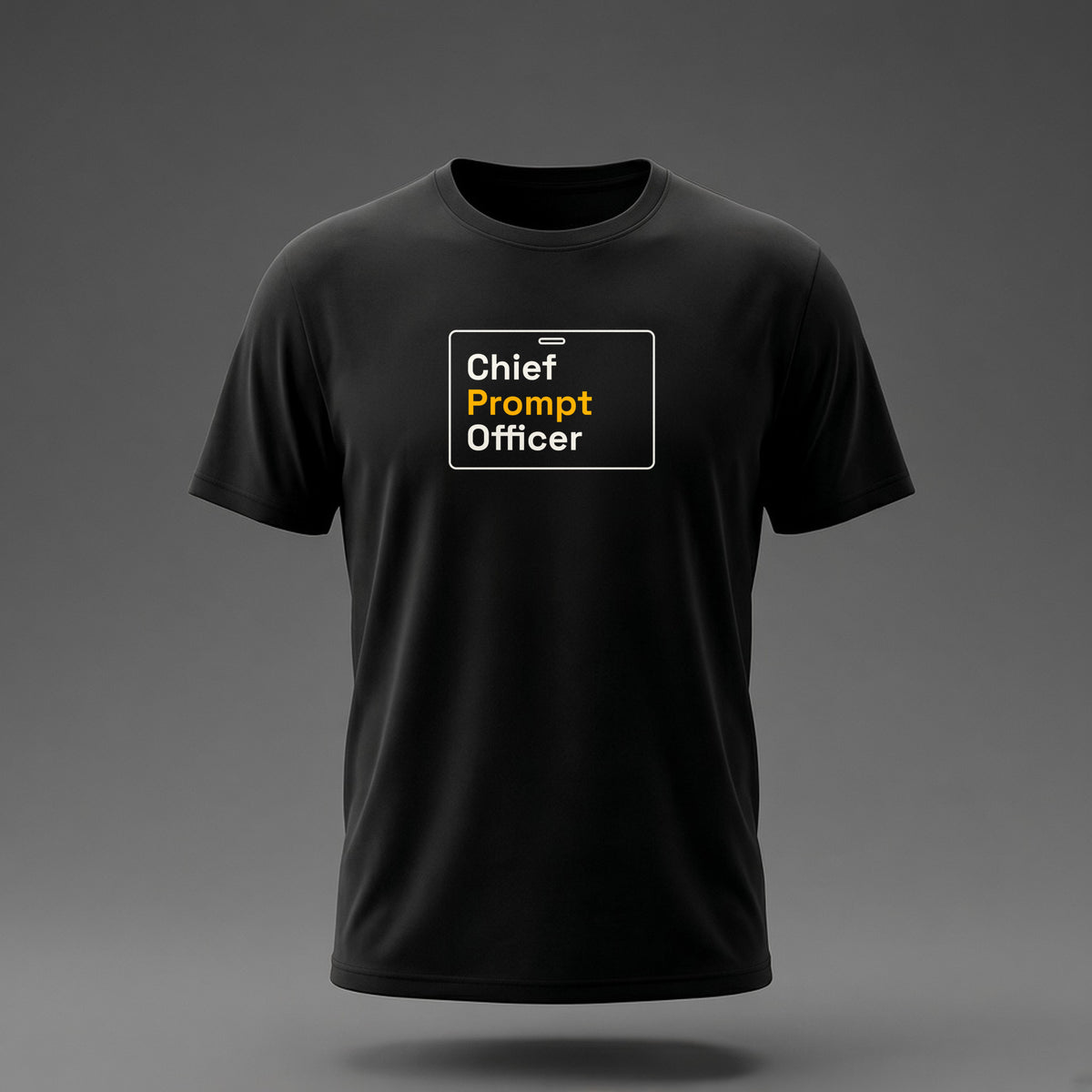 Front view: Black t-shirt floating on a grey background with 'Chief Prompt Officer' on an ID-badge outline printed across the chest in off-white and amber.
