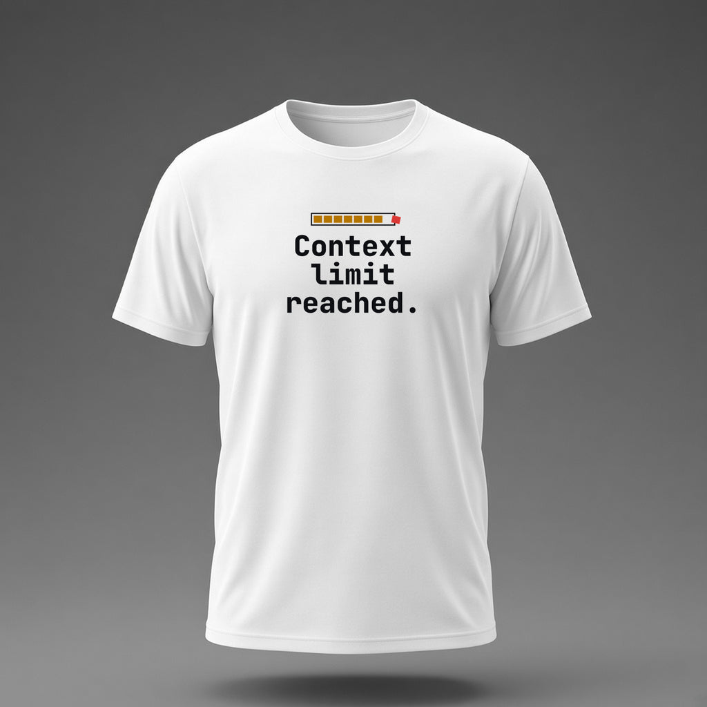 Front view: White t-shirt floating on a grey background with 'Context limit reached.' under a usage meter whose last block bursts out of the frame printed across the chest in black, dark amber and dark red.