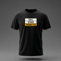 Front view: Black t-shirt floating on a grey background with 'Full Stack Prompter' as three stacked slabs with the words knocked out printed across the chest in off-white and amber.