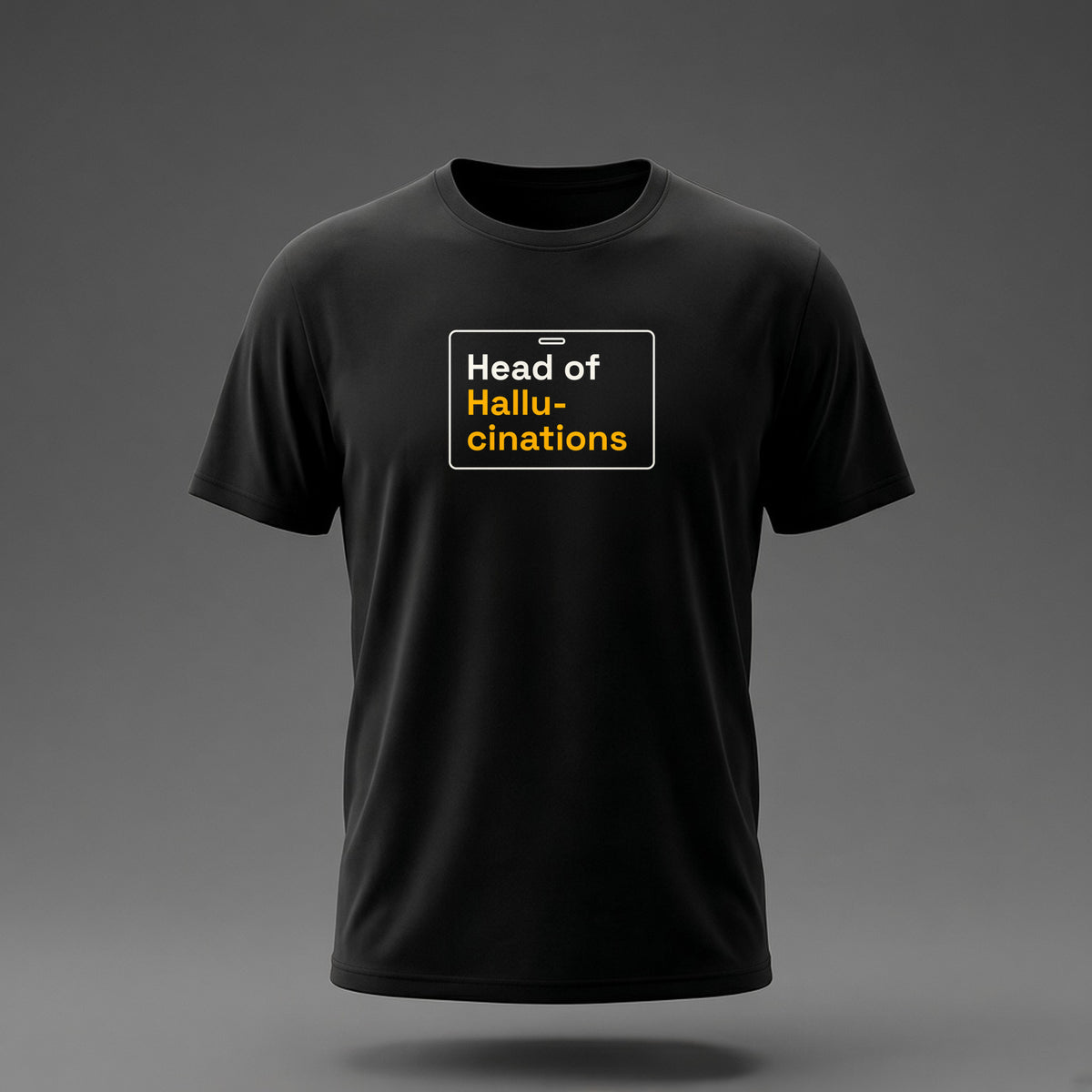 Front view: Black t-shirt floating on a grey background with 'Head of Hallucinations' on an ID-badge outline printed across the chest in off-white and amber.
