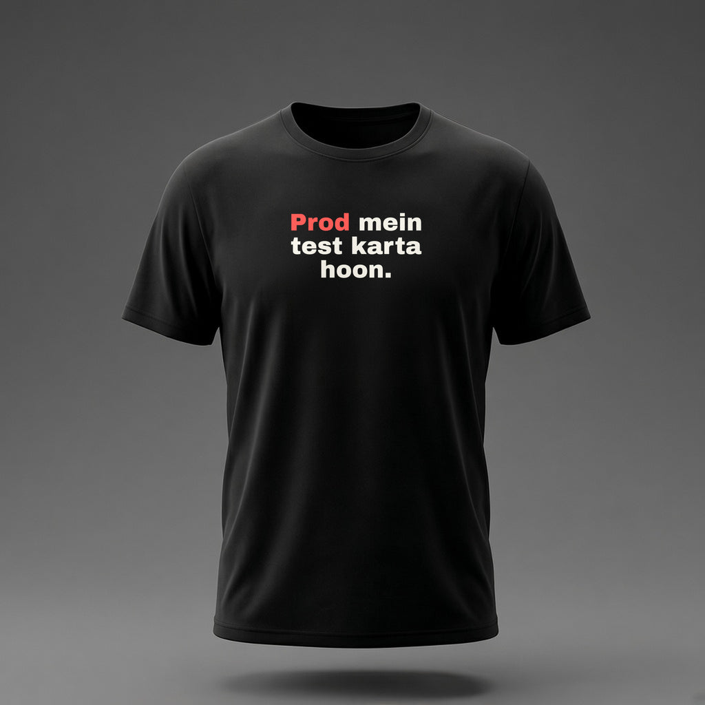 Front view: Black t-shirt floating on a grey background with 'Prod mein test karta hoon.' in three heavy lines printed across the chest in off-white and red.