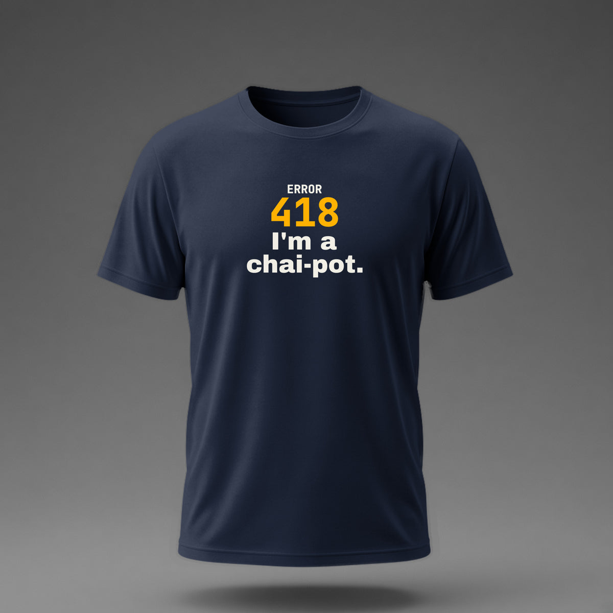 Front view: Navy t-shirt floating on a grey background with 'Error 418: I'm a chai-pot.' with a large 418 printed across the chest in off-white and amber.
