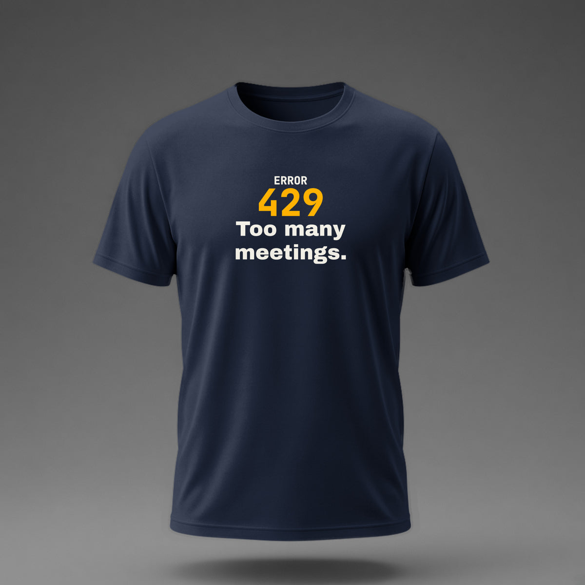 Front view: Navy t-shirt floating on a grey background with 'Error 429: Too many meetings.' with a large 429 printed across the chest in off-white and amber.