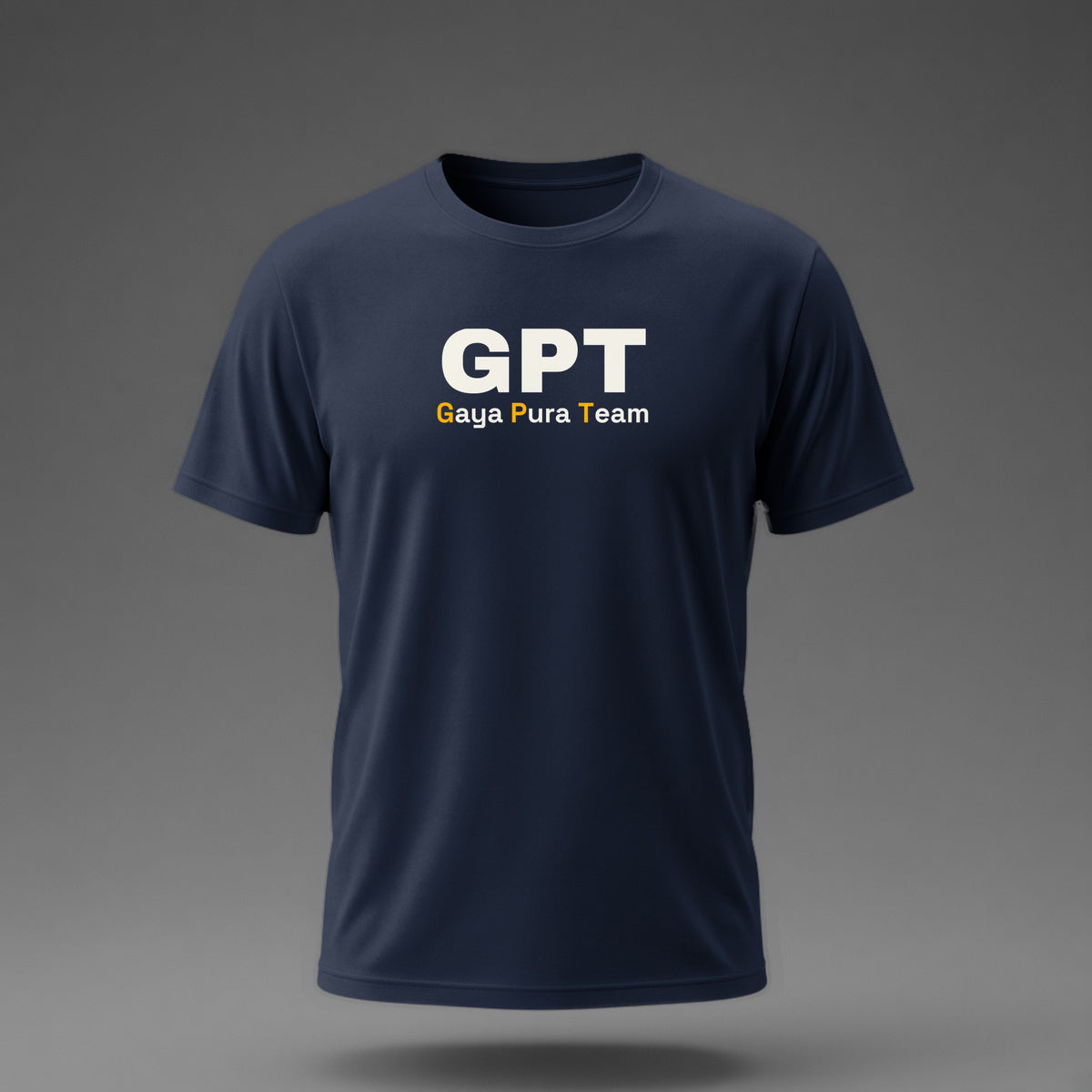 Front view: Navy t-shirt floating on a grey background with a large three-letter acronym over the words 'Gaya Pura Team' printed across the chest in off-white and amber.