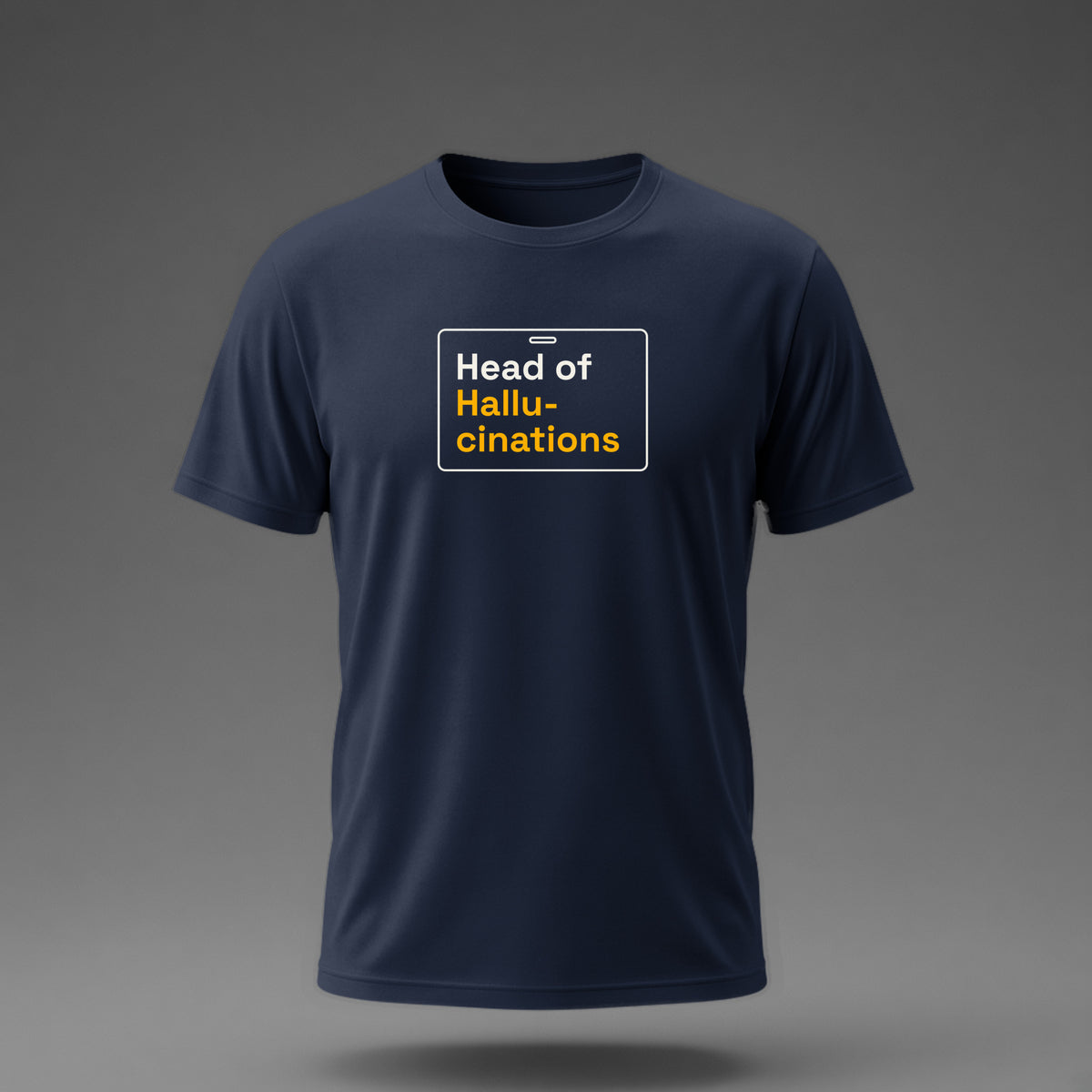 Front view: Navy t-shirt floating on a grey background with 'Head of Hallucinations' on an ID-badge outline printed across the chest in off-white and amber.