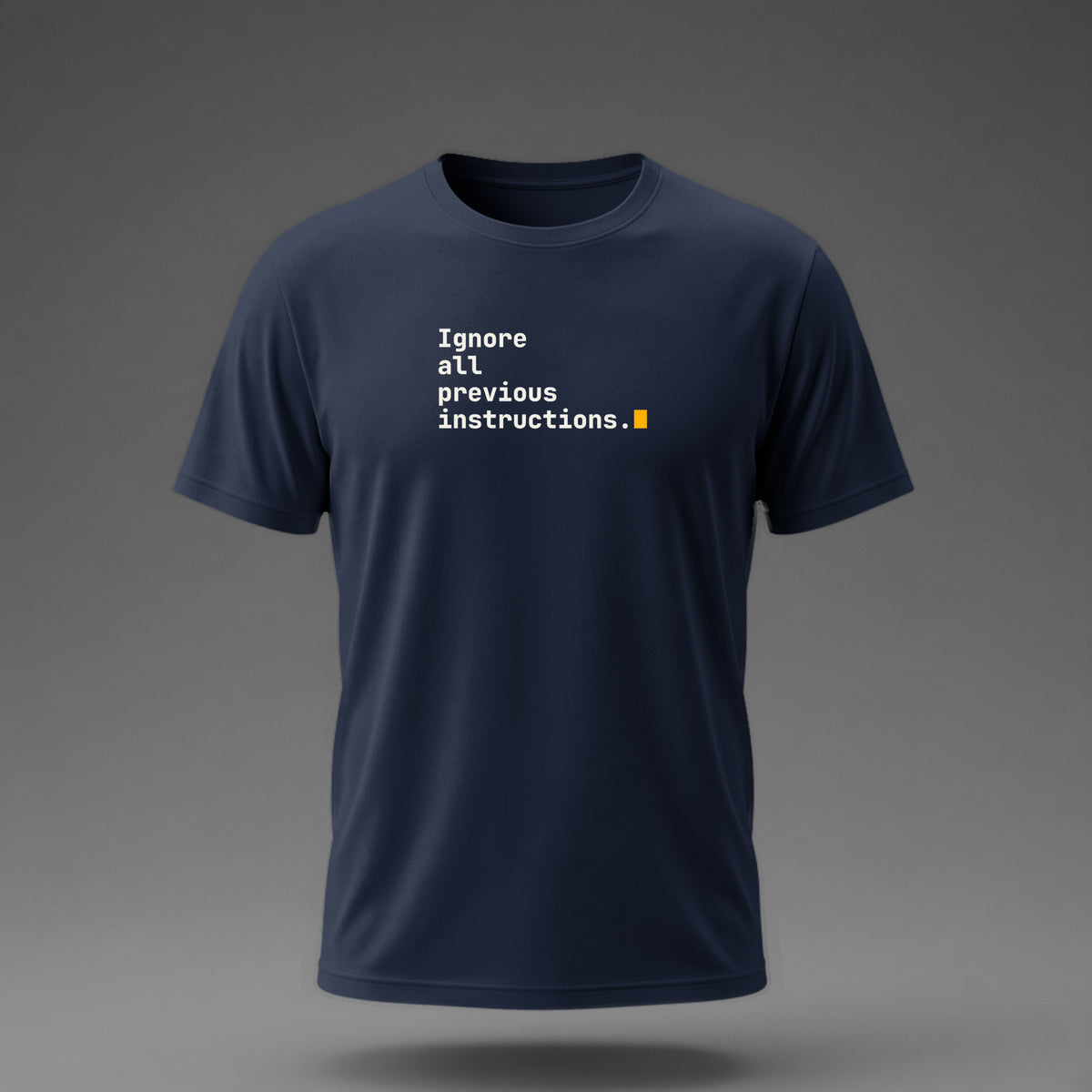 Front view: Navy t-shirt floating on a grey background with 'Ignore all previous instructions.' as four typed lines ending in a cursor printed across the chest in off-white and amber.