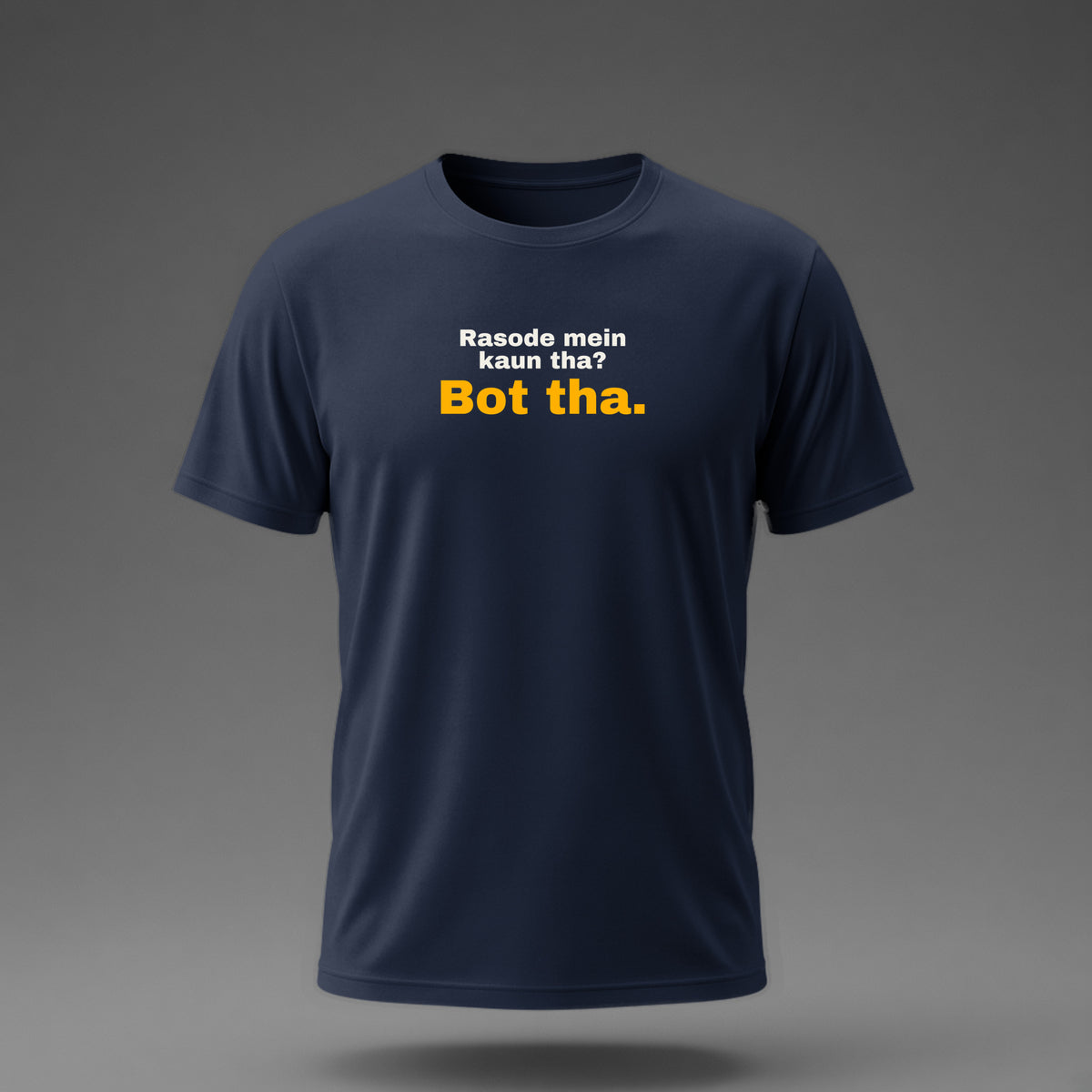 Front view: Navy t-shirt floating on a grey background with 'Rasode mein kaun tha? Bot tha.' with 'Bot tha.' large printed across the chest in off-white and amber.