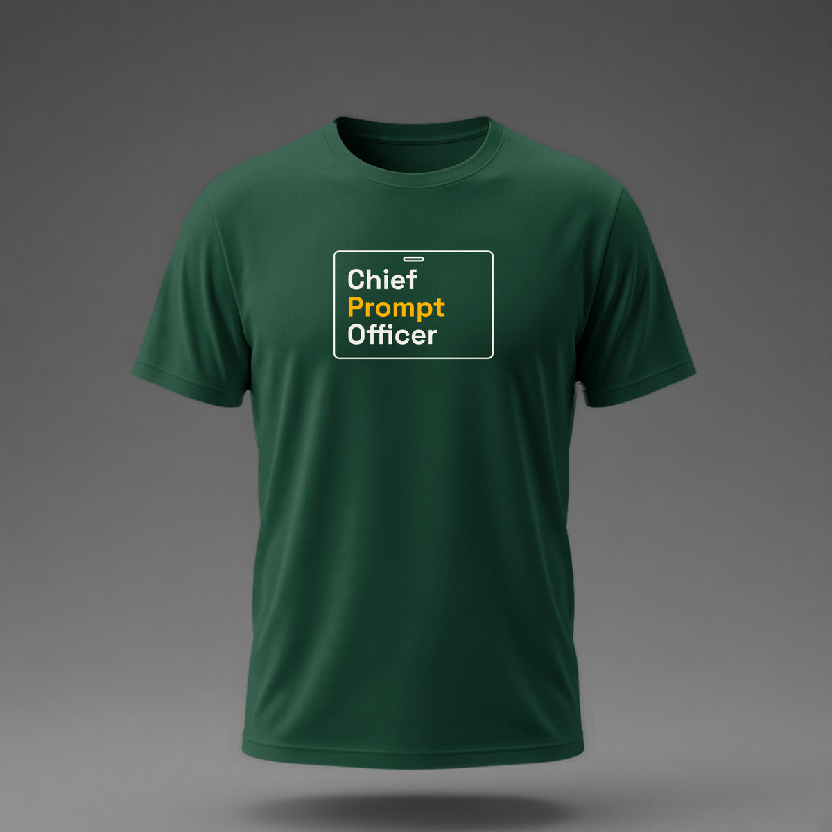 Front view: Bottle Green t-shirt floating on a grey background with 'Chief Prompt Officer' on an ID-badge outline printed across the chest in off-white and amber.
