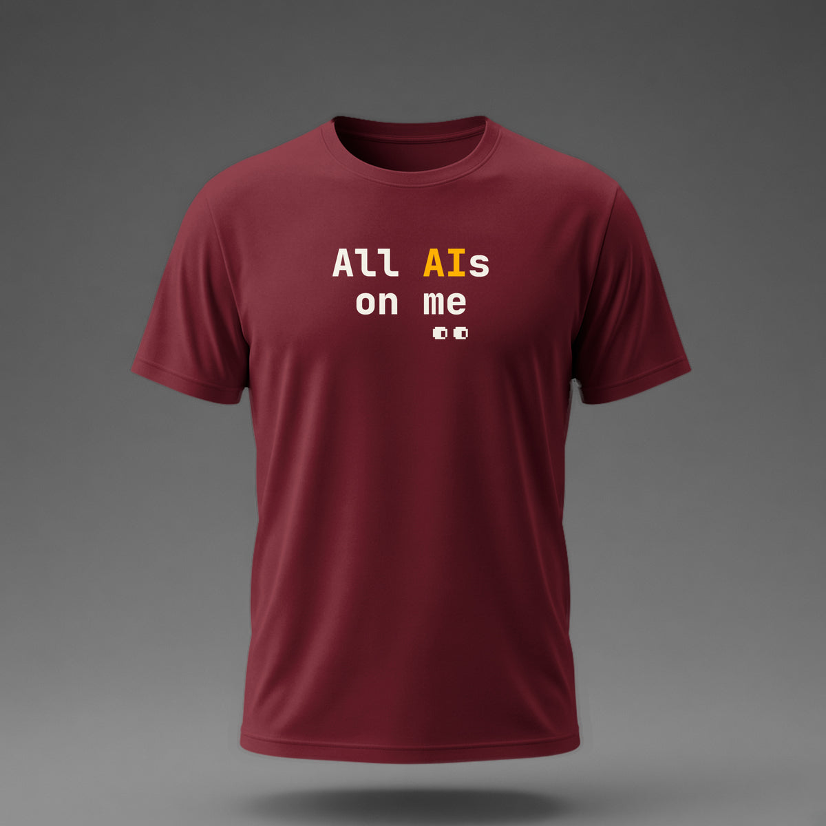 Front view: Maroon t-shirt floating on a grey background with 'All AIs on me' stacked on two lines with small pixel eyes below printed across the chest in off-white and amber.