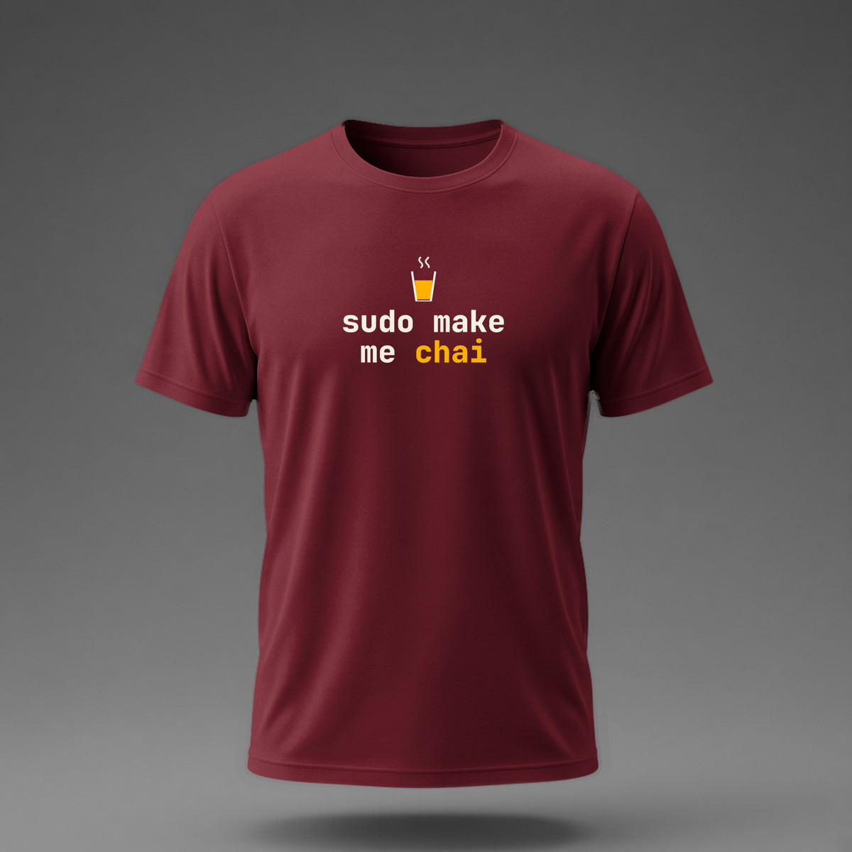 Front view: Maroon t-shirt floating on a grey background with 'sudo make me chai' in two heavy mono lines under a cutting-chai glass printed across the chest in off-white and amber.